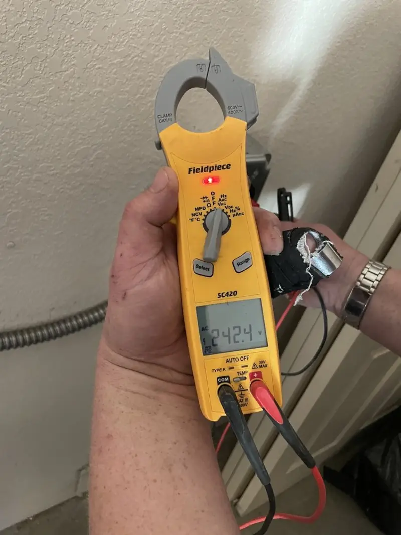 Voltage testing with clamp meter during Generator Installation in Maplewood